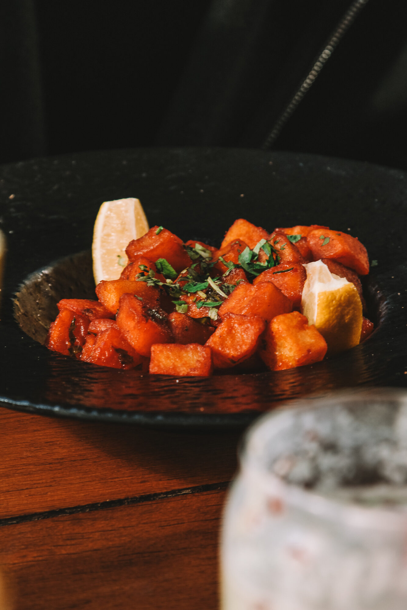 Sweet potato dish on dark slate plate